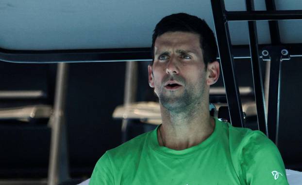 Serbian tennis player Novak Djokovic rests at Melbourne Park as questions remain over the legal battle regarding his visa to play in the Australian Open