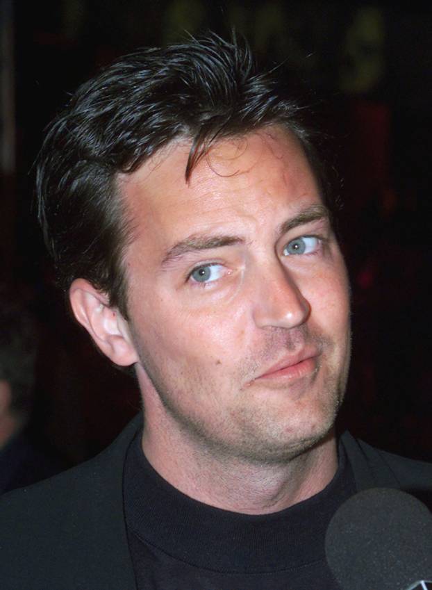 FILE PHOTO: Actor Matthew Perry, star of the comedy television series " Friends" is interviewed as he arrives as..