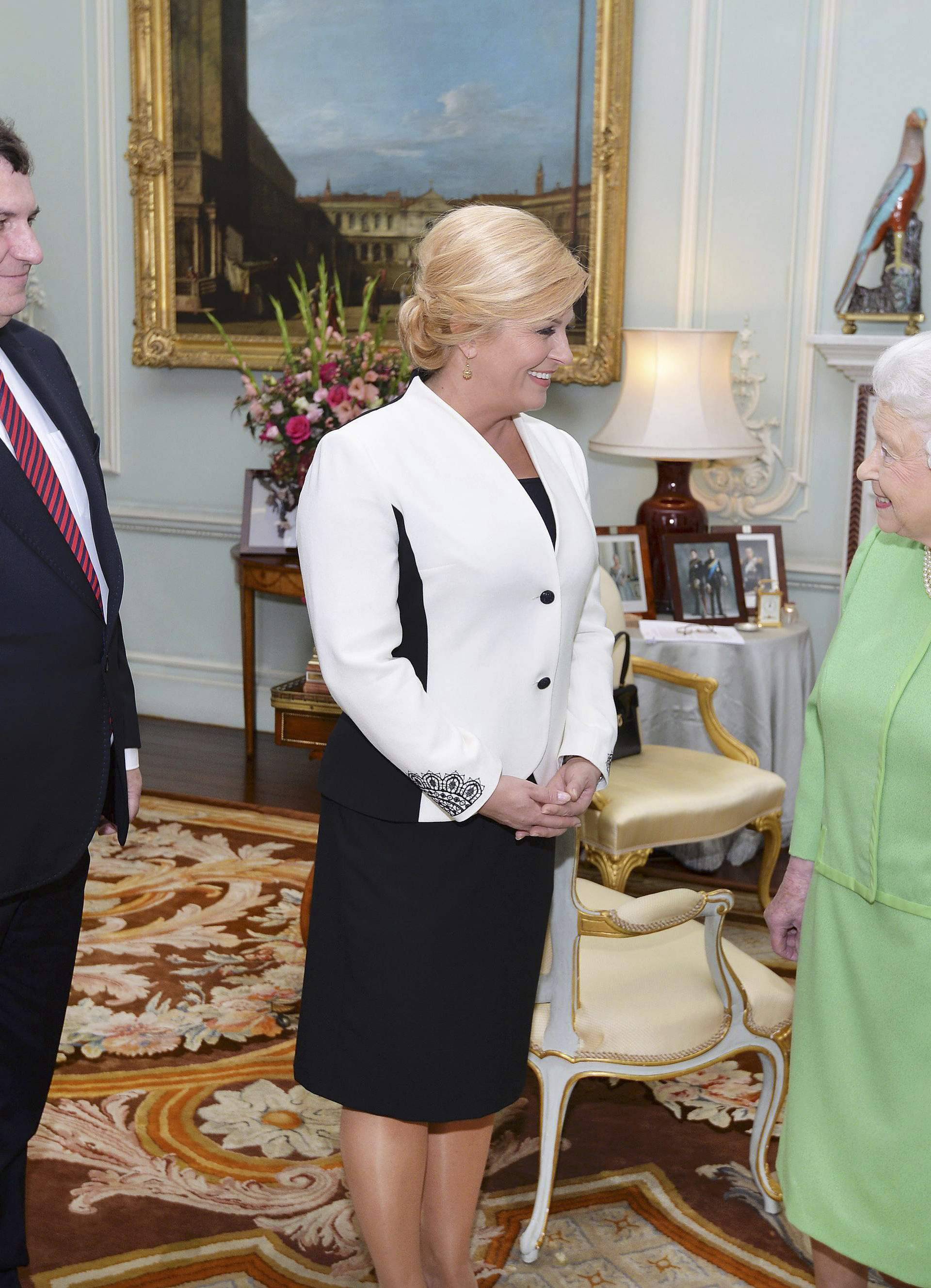 Queen Elizabeth greets the President of Croatia Kolinda Grabar-Kitarovic and her husband Jakov at Buckingham Palace in London