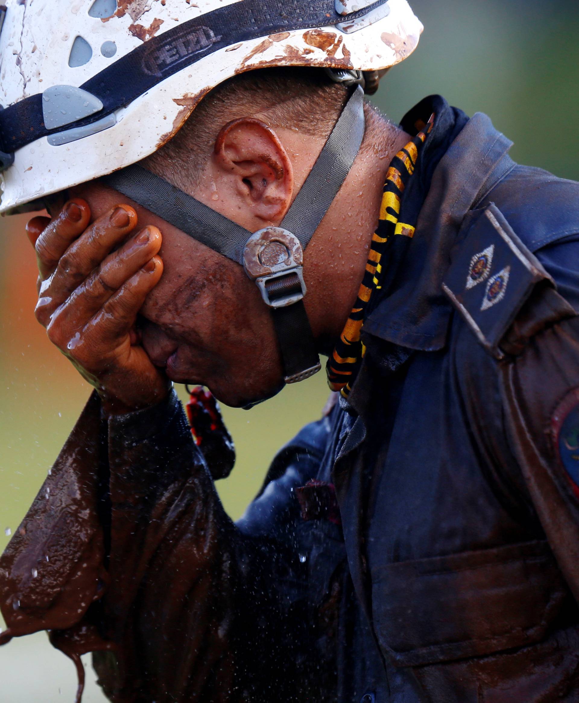A member of rescue team reacts, upon returning from the mission, after a tailings dam owned by Brazilian mining company Vale SA collapsed, in Brumadinho