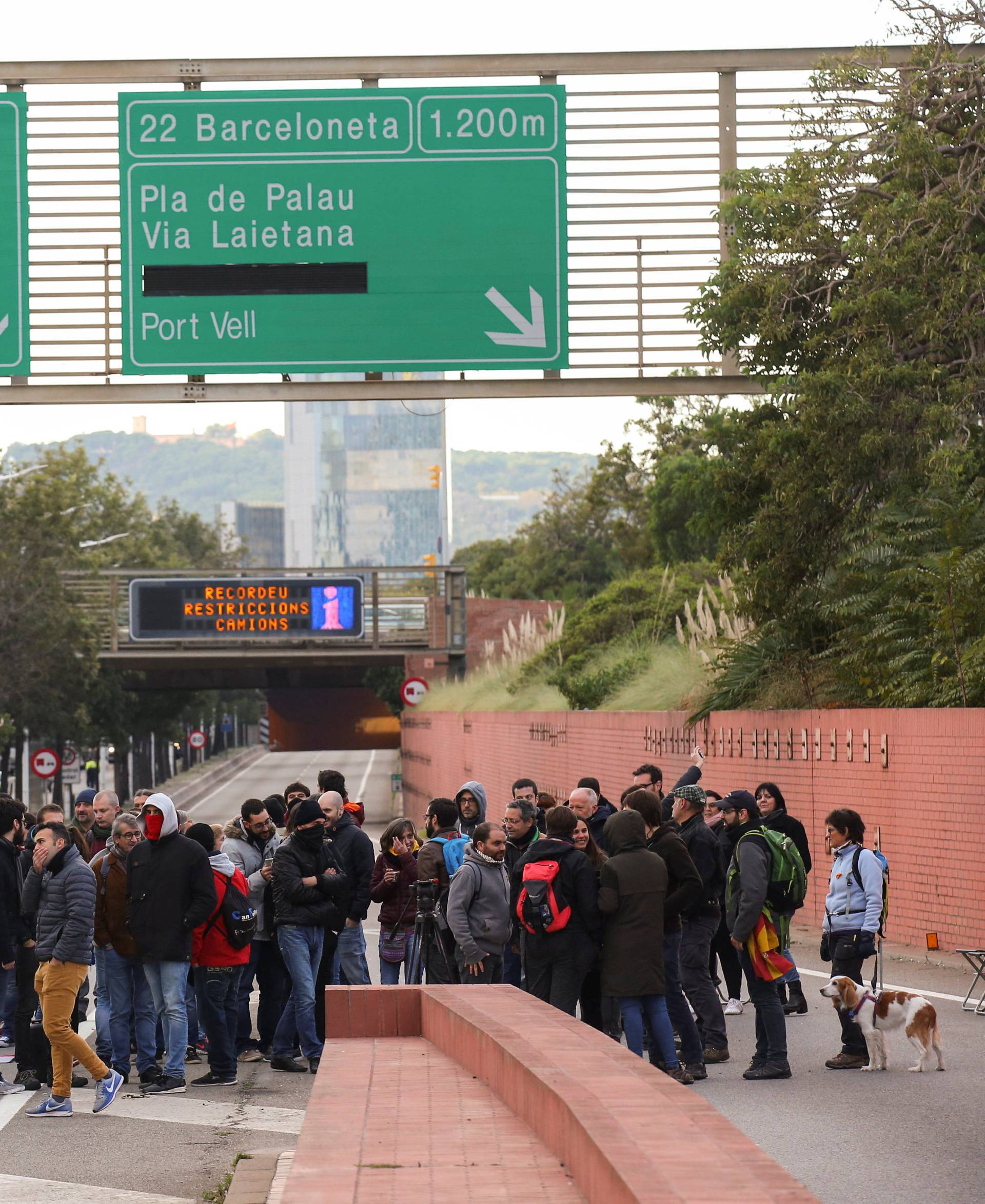 Protestors block a ring road in Barcelona during a partial regional strike in Barcelona