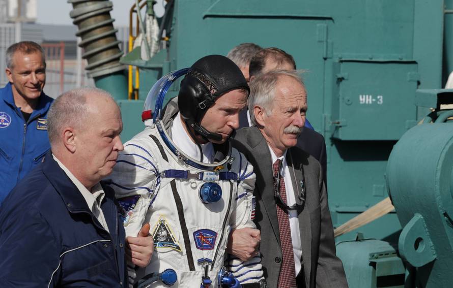 International Space Station (ISS) crew member astronaut Nick Hague of the U.S. walks to board the Soyuz MS-10 spacecraft for the launch at the Baikonur Cosmodrome