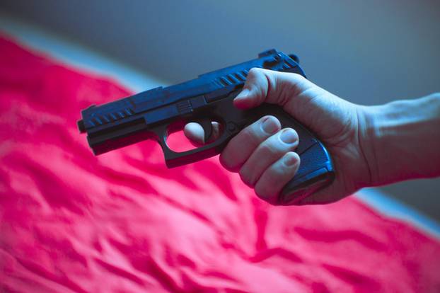 Firearm held by a man