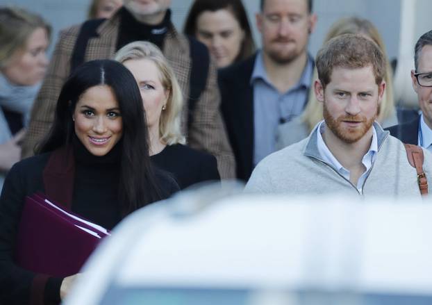 Prince Harry and his wife Meghan Markle pictured arriving in Sydney.
