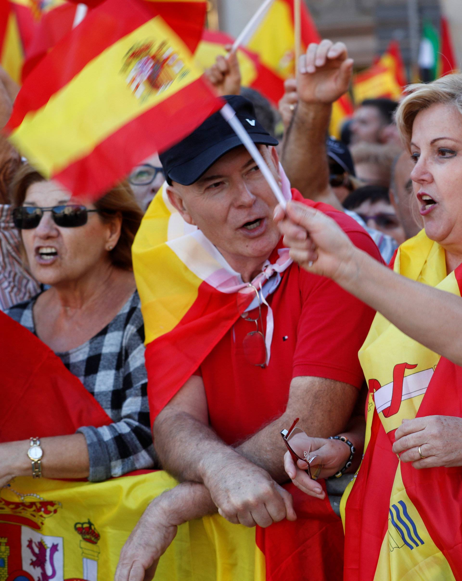 Pro-unity supporters take part in a demonstration in central Barcelona