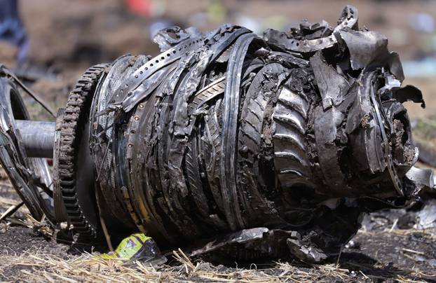 Airplane engine parts are seen at the scene of the Ethiopian Airlines Flight ET 302 plane crash, near the town of Bishoftu