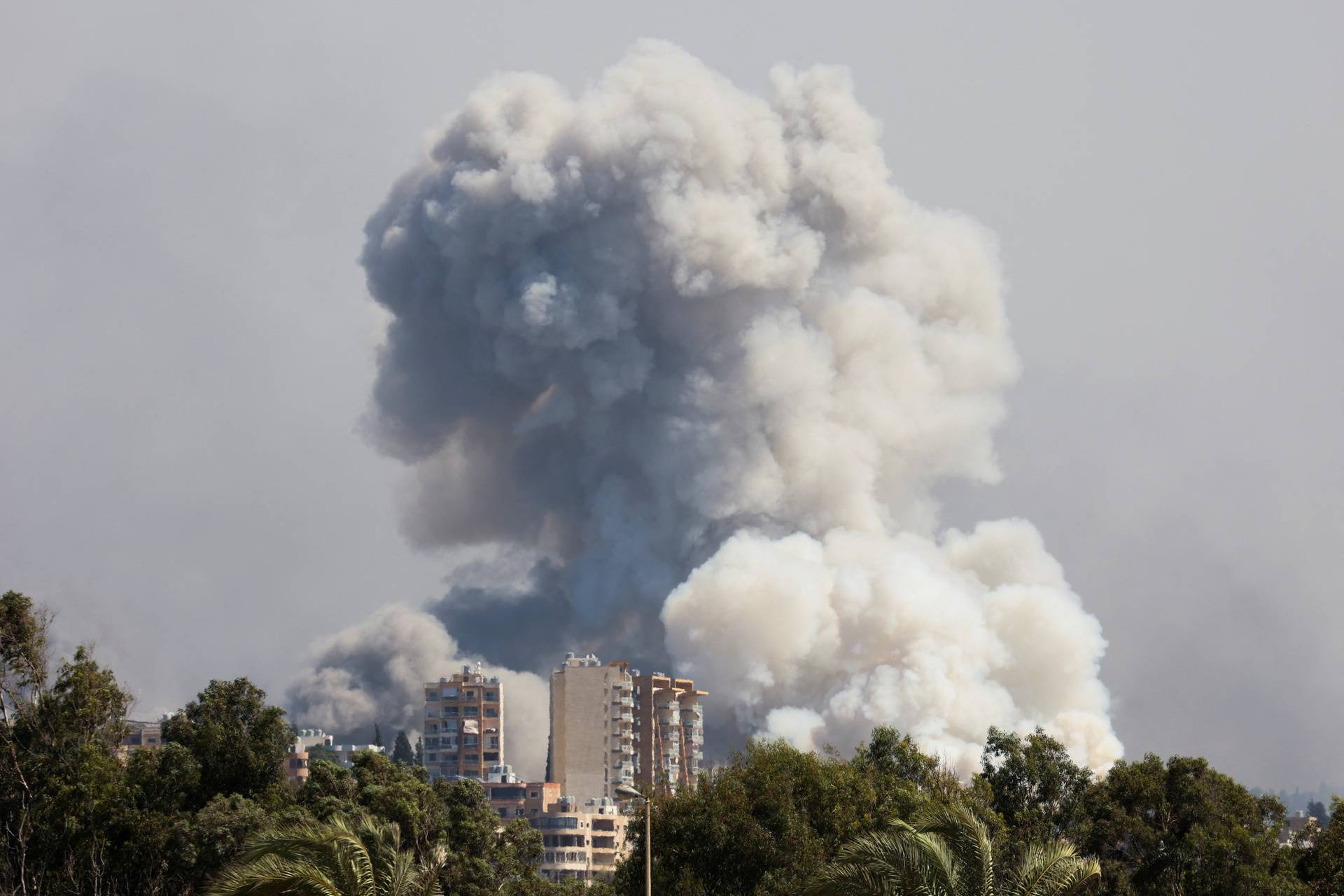 Smoke billows over southern Lebanon following Israeli strikes, as seen from Tyre, southern Lebanon