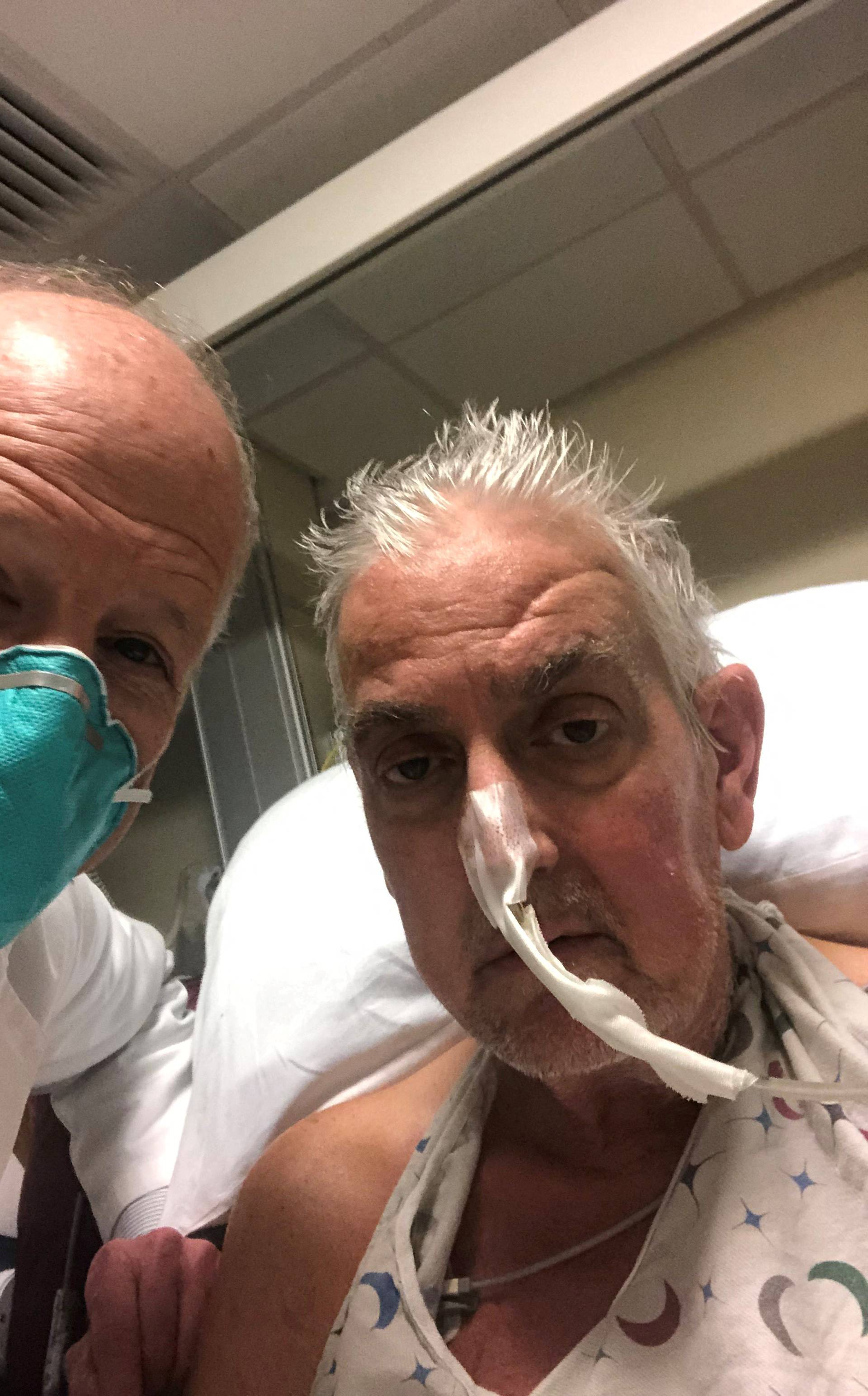 David Bennett poses with surgeon before pig heart transplant in Baltimore