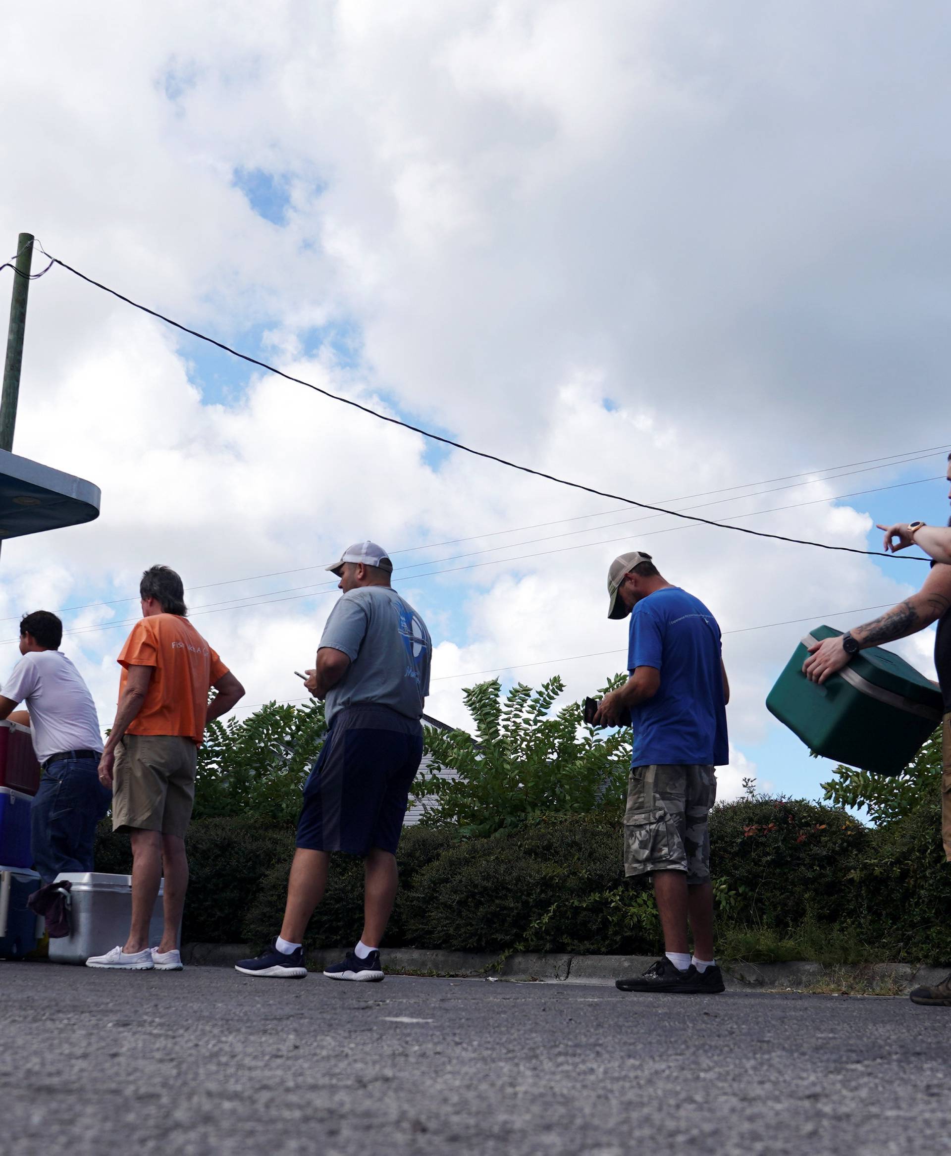 People line up for ice before Hurricane Florence comes ashore in Carolina Beach