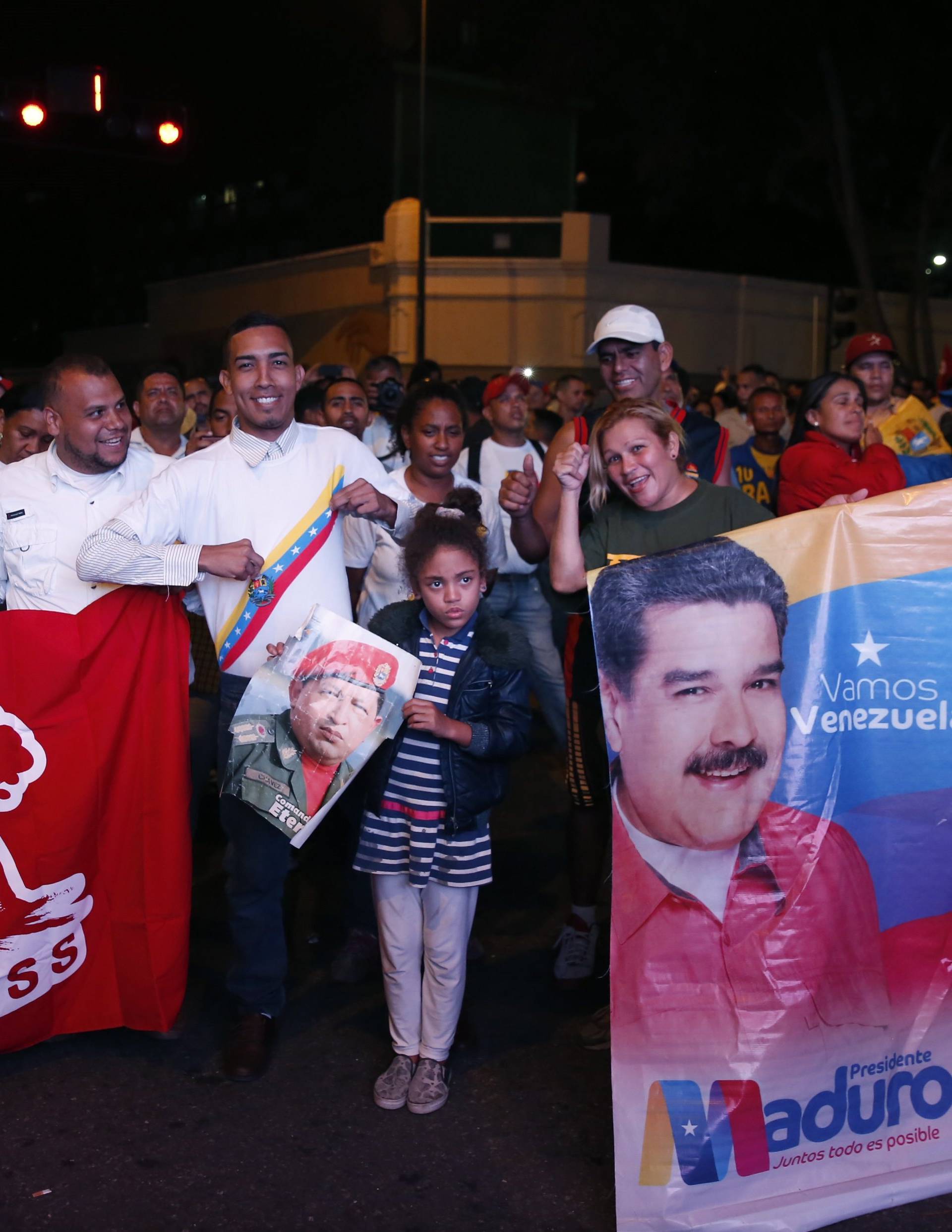 Supporters of Venezuela's President Nicolas Maduro celebrate the results of the election in Caracas