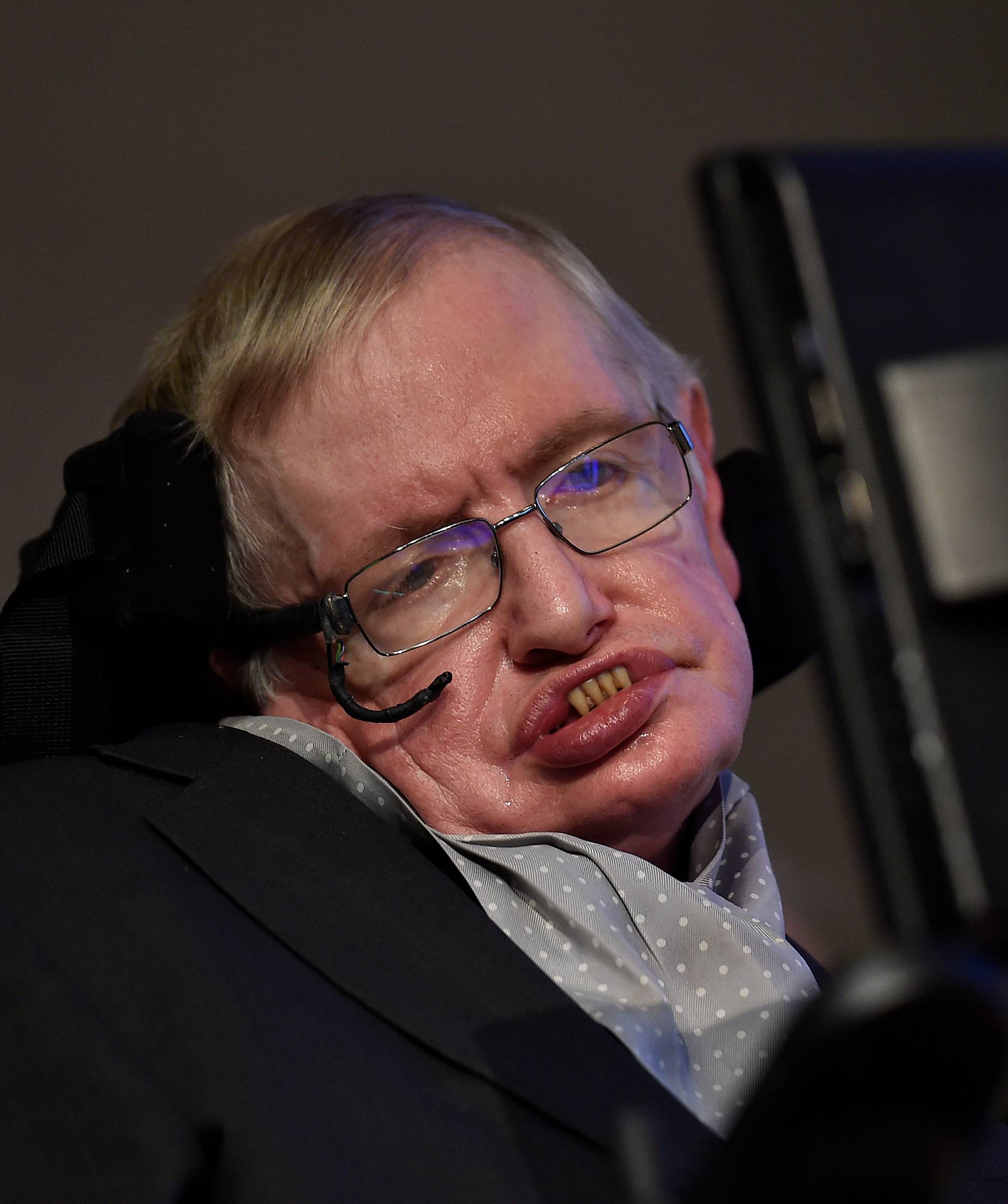 FILE PHOTO: British scientist and theoretical physicist Hawking attends a launch event for a new award for science communication in London