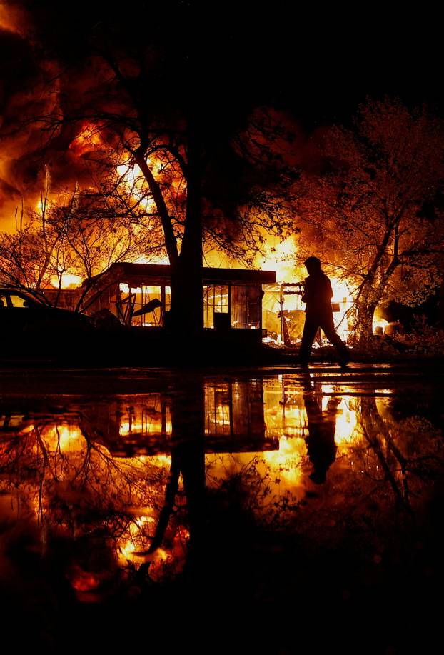 Rescuers work at the site of a Russian missile strike, amid Russia's attack on Ukraine, in Kyiv