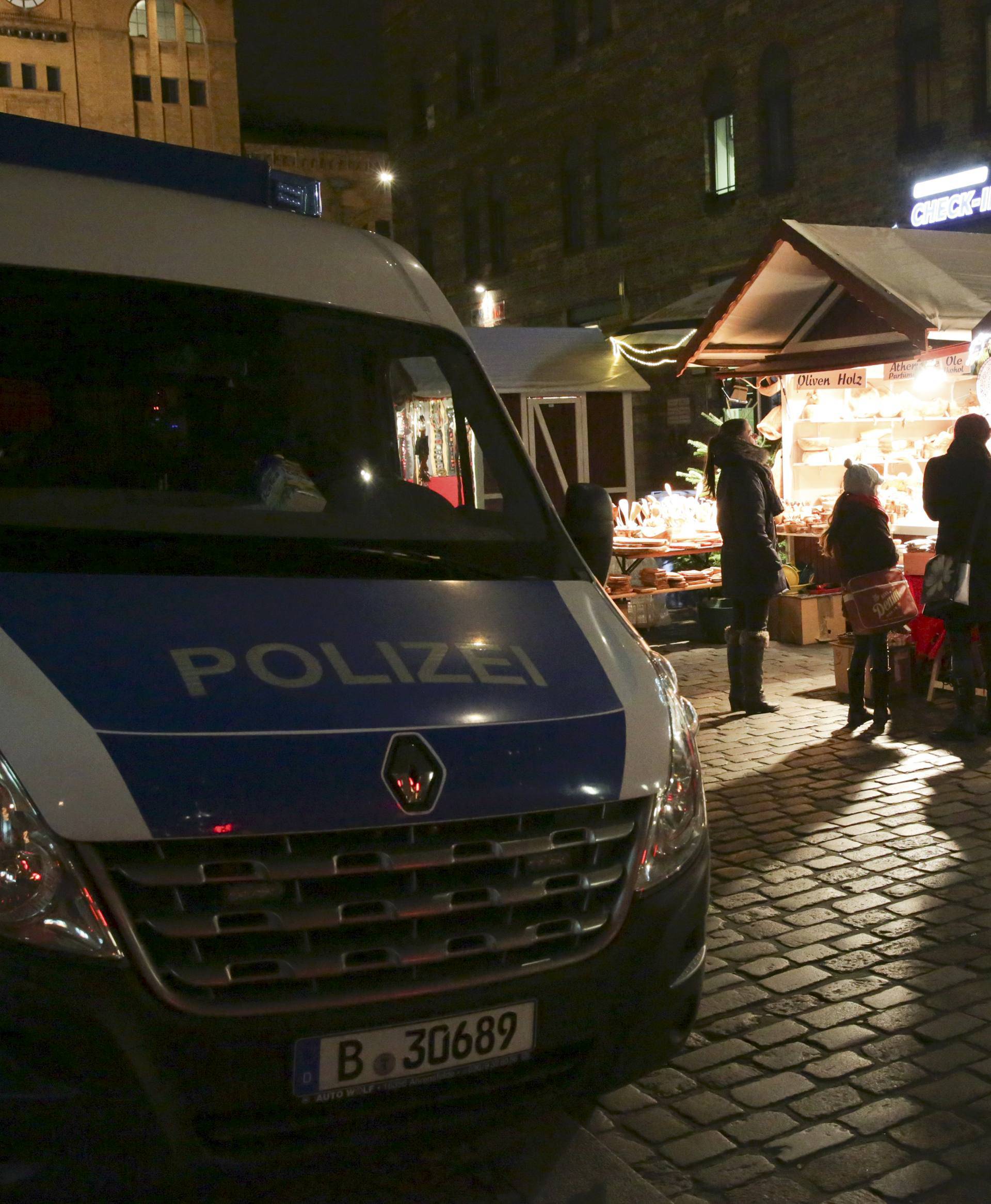 German police guards a Christmas market in the Prenzlauer Berg district in Berlin