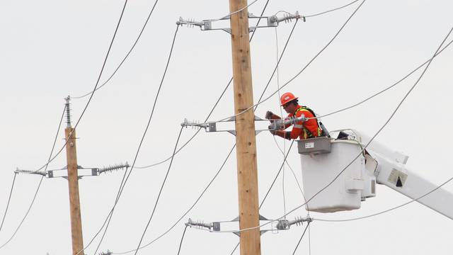 Crews continue working to restore power after a strong storm damaged electric power infrastructure, in Ottawa