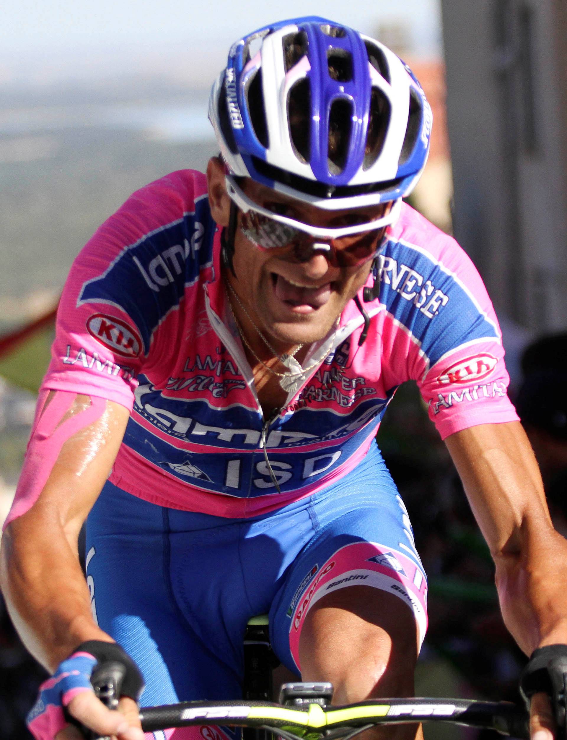 FILE PHOTO: Lampre's Scarponi of Italy cycles during eighth stage of the Tour of Spain cycling race between Talavera de la Reina and San Lorenzo de El Escorial