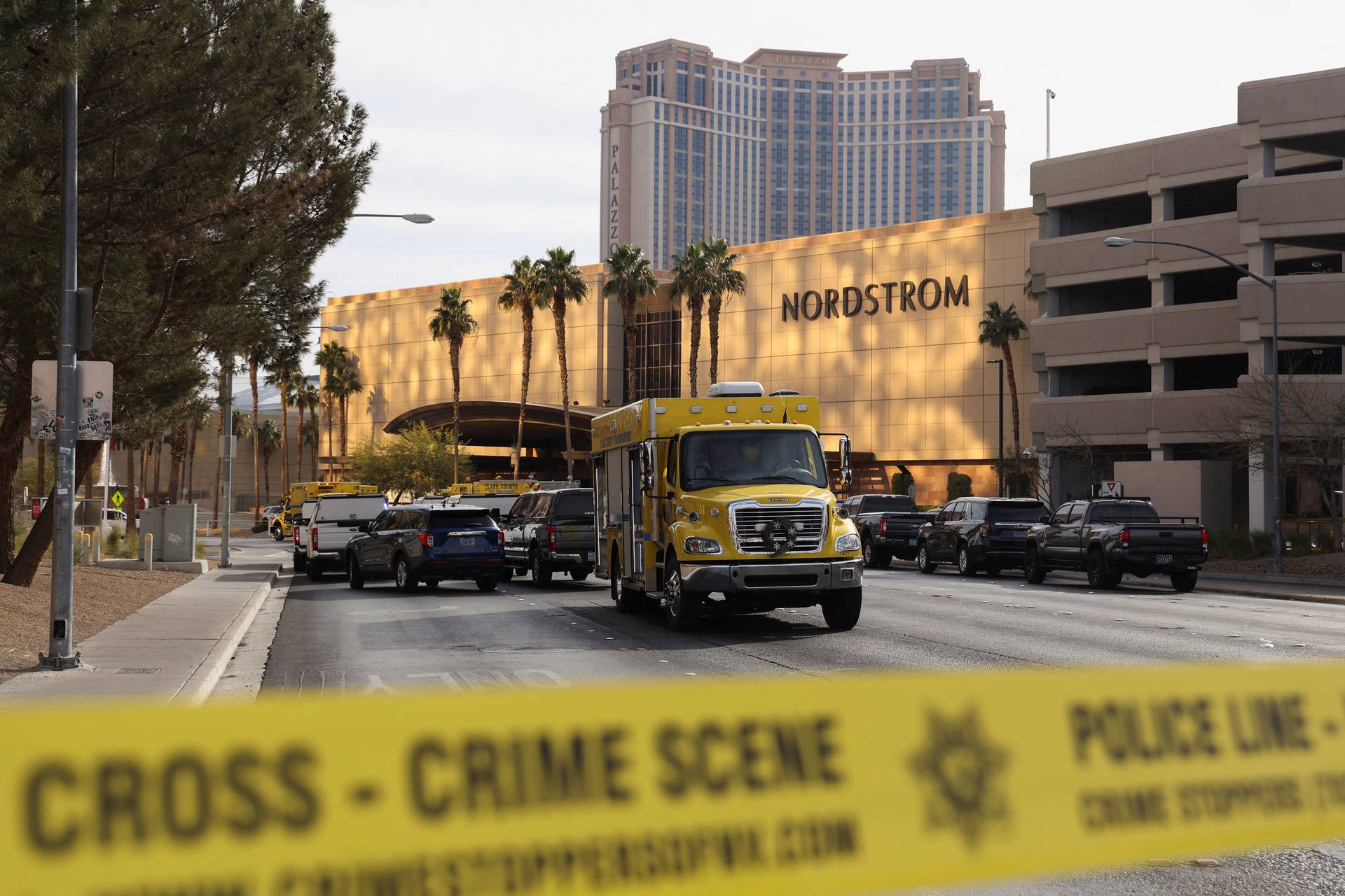 Firefighters work at the Tesla Cybertruck which burned at the entrance of Trump Tower in Las Vegas