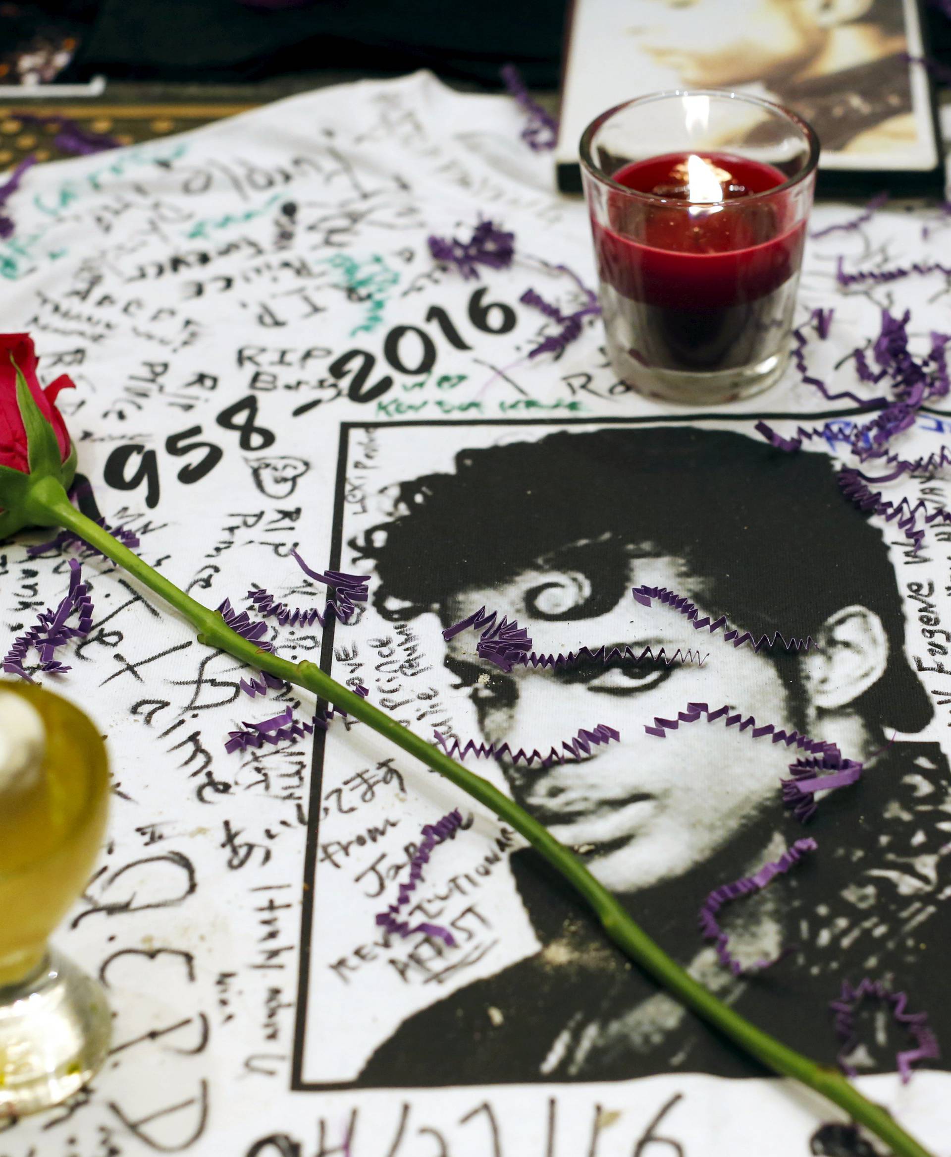 A makeshift memorial is seen as fans gather at Harlem's Apollo Theater to celebrate the life of deceased musician Prince in the Manhattan borough of New York, U.S.