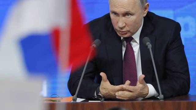 Russian President Putin speaks during annual news conference in Moscow