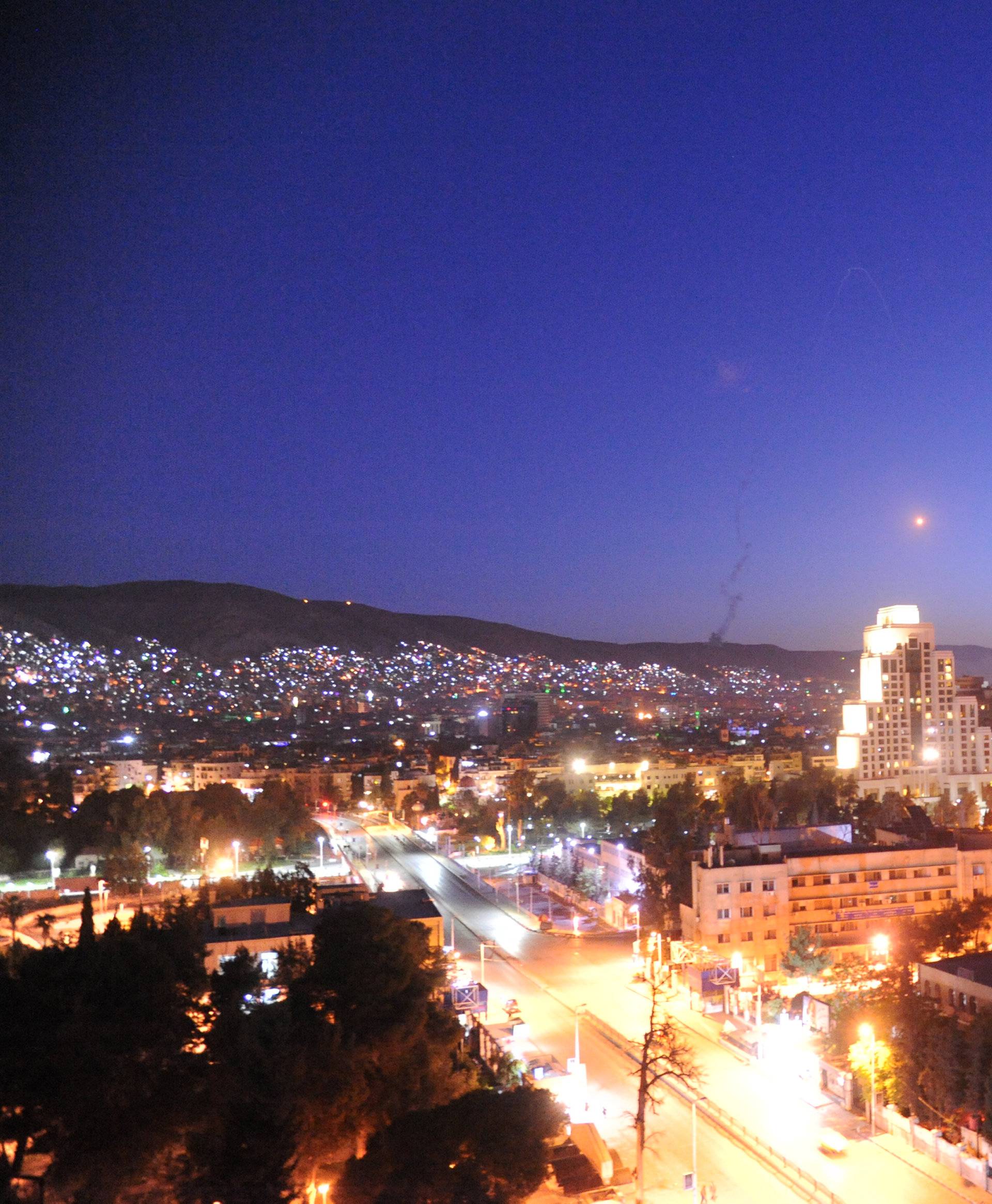 A missile is seen crossing over Damascus