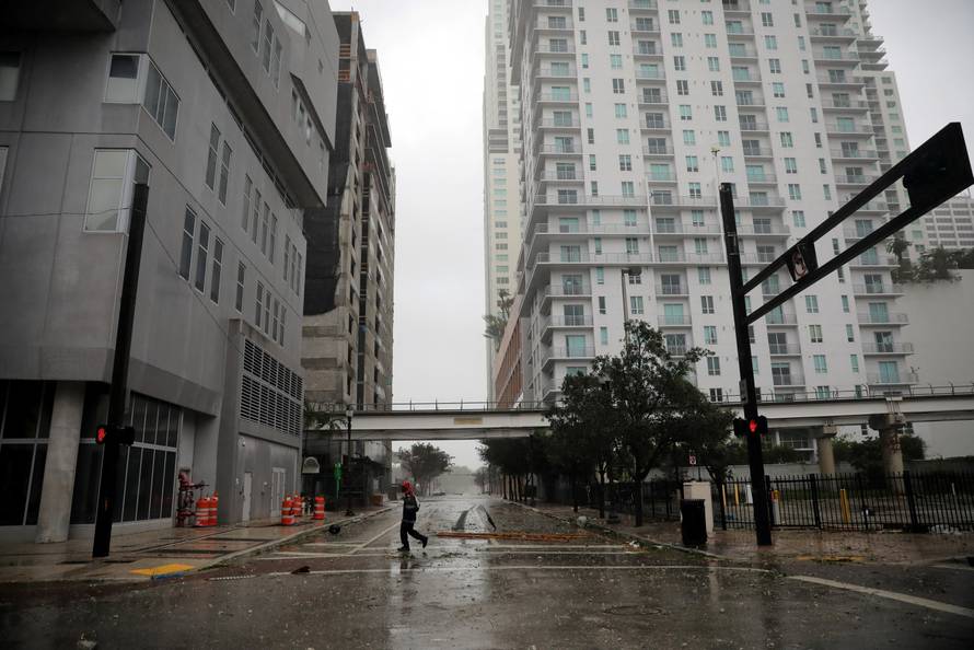 A man walks along an empty street as Hurricane Irma arrives at south Florida, in downtown Miami, Florida, U.S.