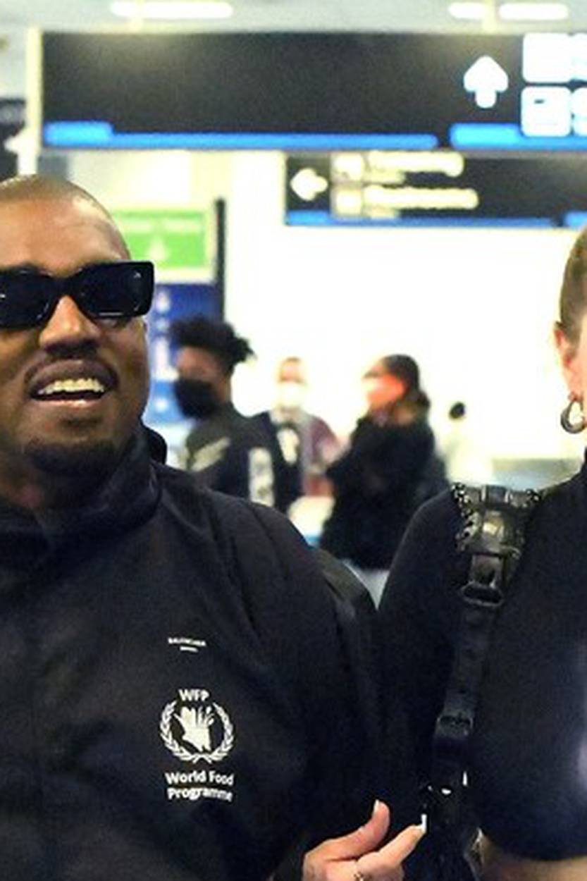 *PREMIUM EXCLUSIVE* Kanye West is all smiles as he reunites with girlfriend Julia Fox at Miami International Airport