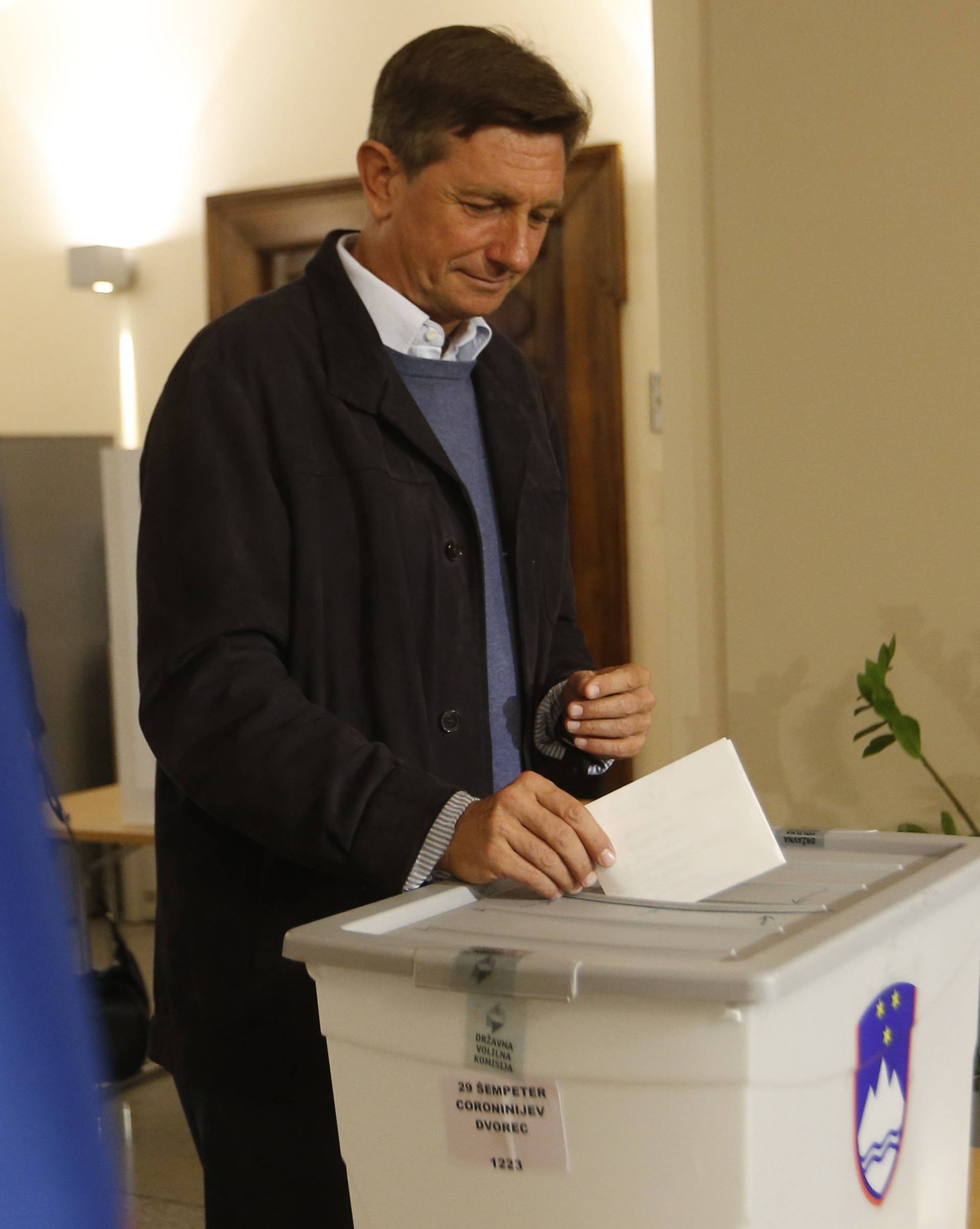 Presidential candidate Borut Pahor casts his ballot at a polling station during the presidential election in Sempeter pri Novi Gorici