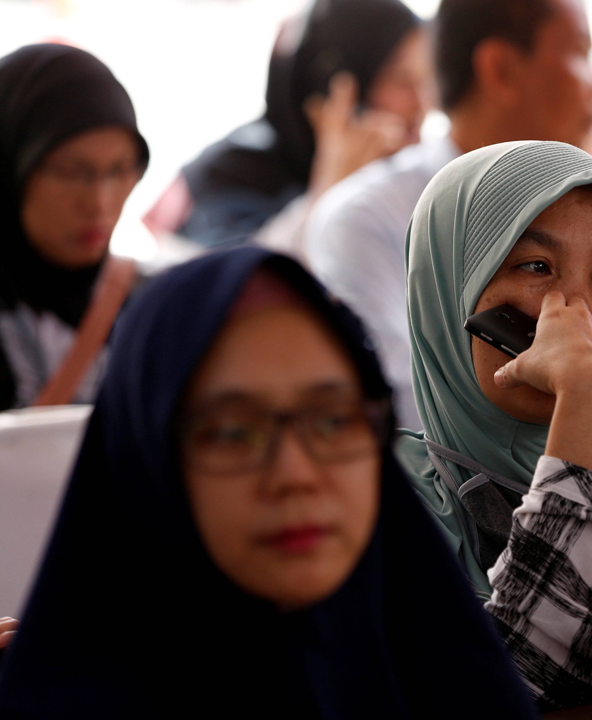 Relatives of passengers on the crashed Lion Air flight JT610 wait at Bhayangkara R. Said Sukanto hospital in Jakarta