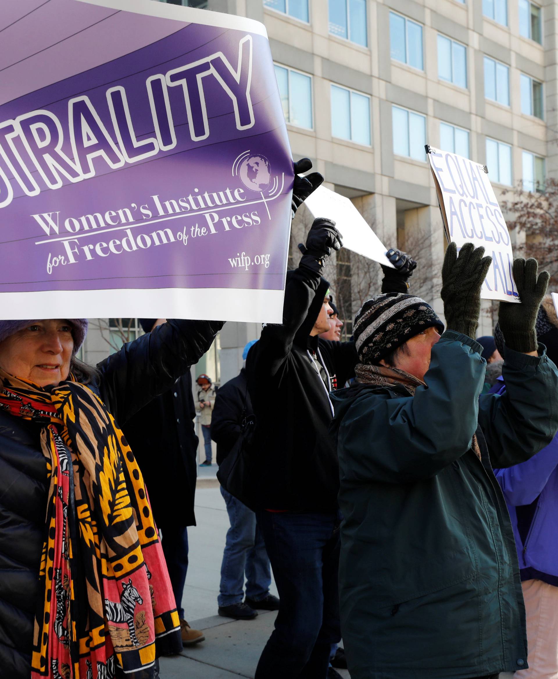 Net neutrality advocates rally in front of the Federal Communications Commission in Washington