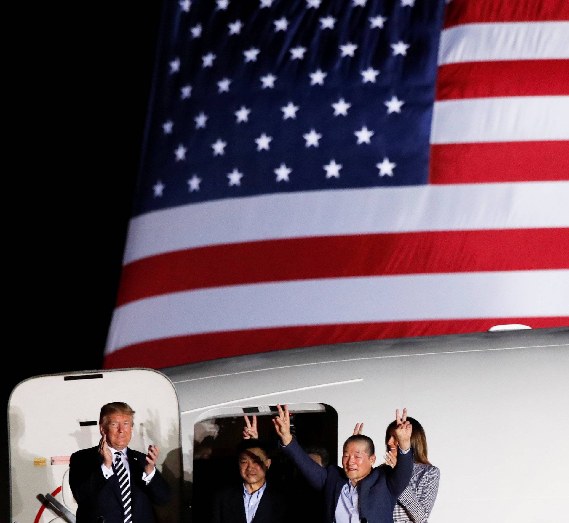 U.S.President Donald Trump and first lady Melania Trump greet the Americans formerly held hostage in North Korea, upon their arrival at Joint Base Andrews