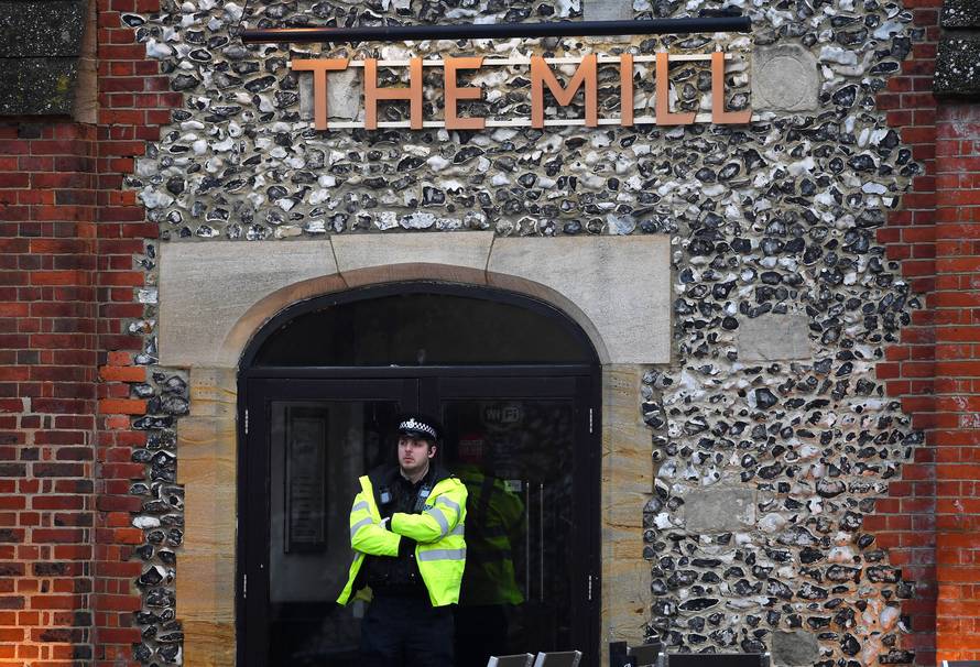 A police officer stands on duty after former Russian inteligence officer Sergei Skripal, and a woman were found unconscious on a bench nearby after they had been exposed to an unknown substance, in Salisbury
