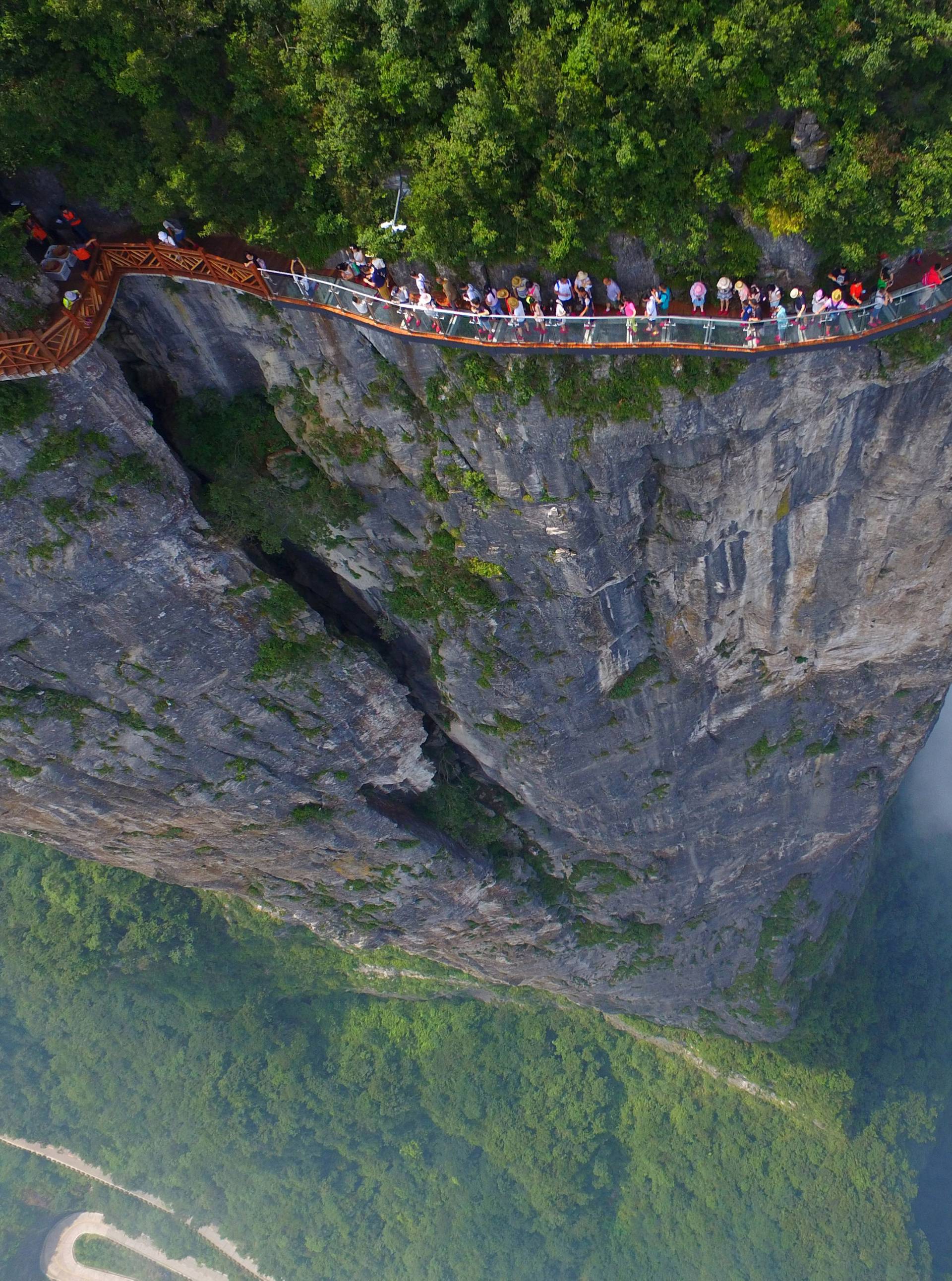 People walk on a sightseeing platform in Zhangjiajie, Hunan Province, China