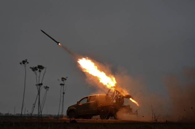 Police officers fire MLRS towards Russian troops in a front line in Zaporizhzhia region