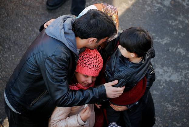 Rescue workers search the site of a collapsed building, after an earthquake in Elazig