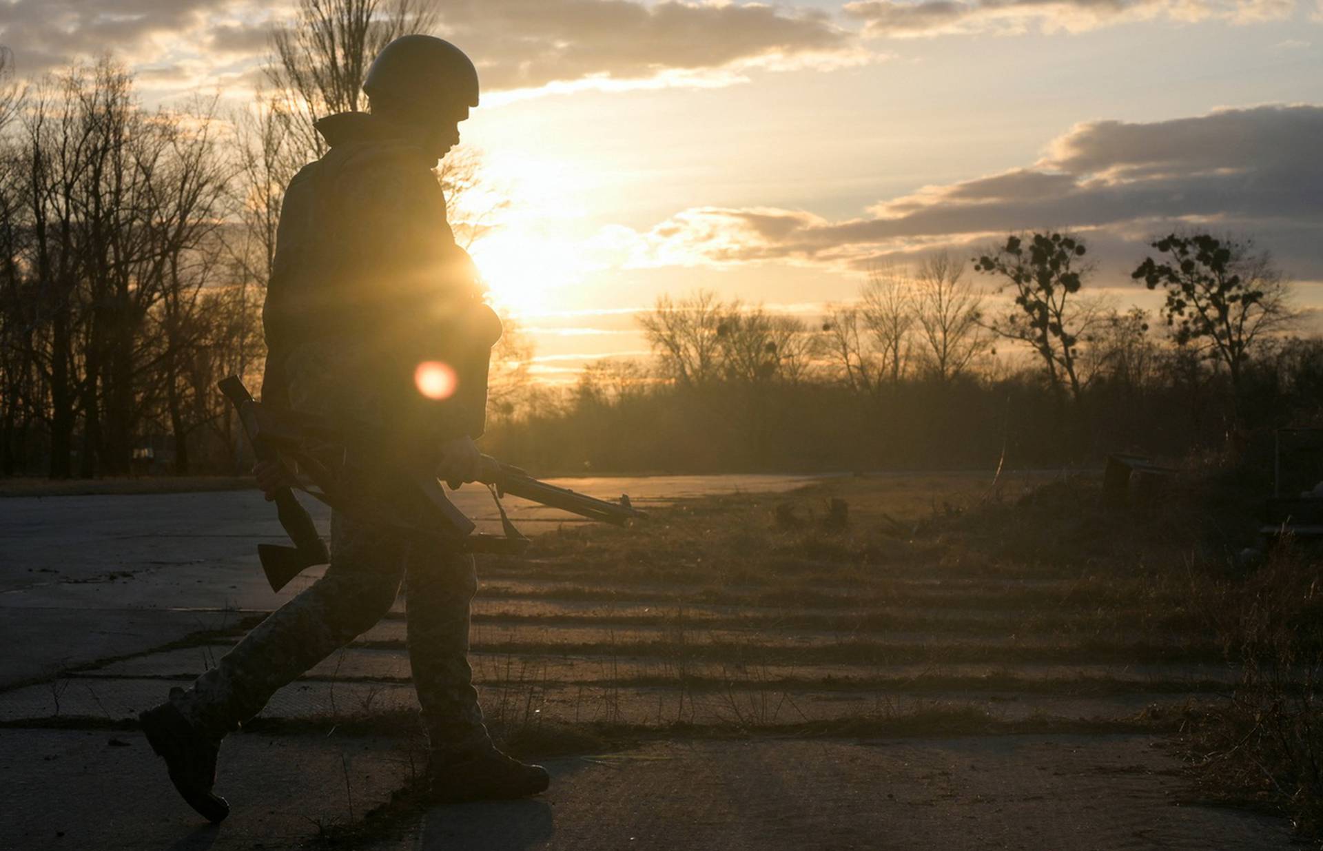 A Ukrainian serviceman takes position at the military airbase Vasylkiv in the Kyiv region