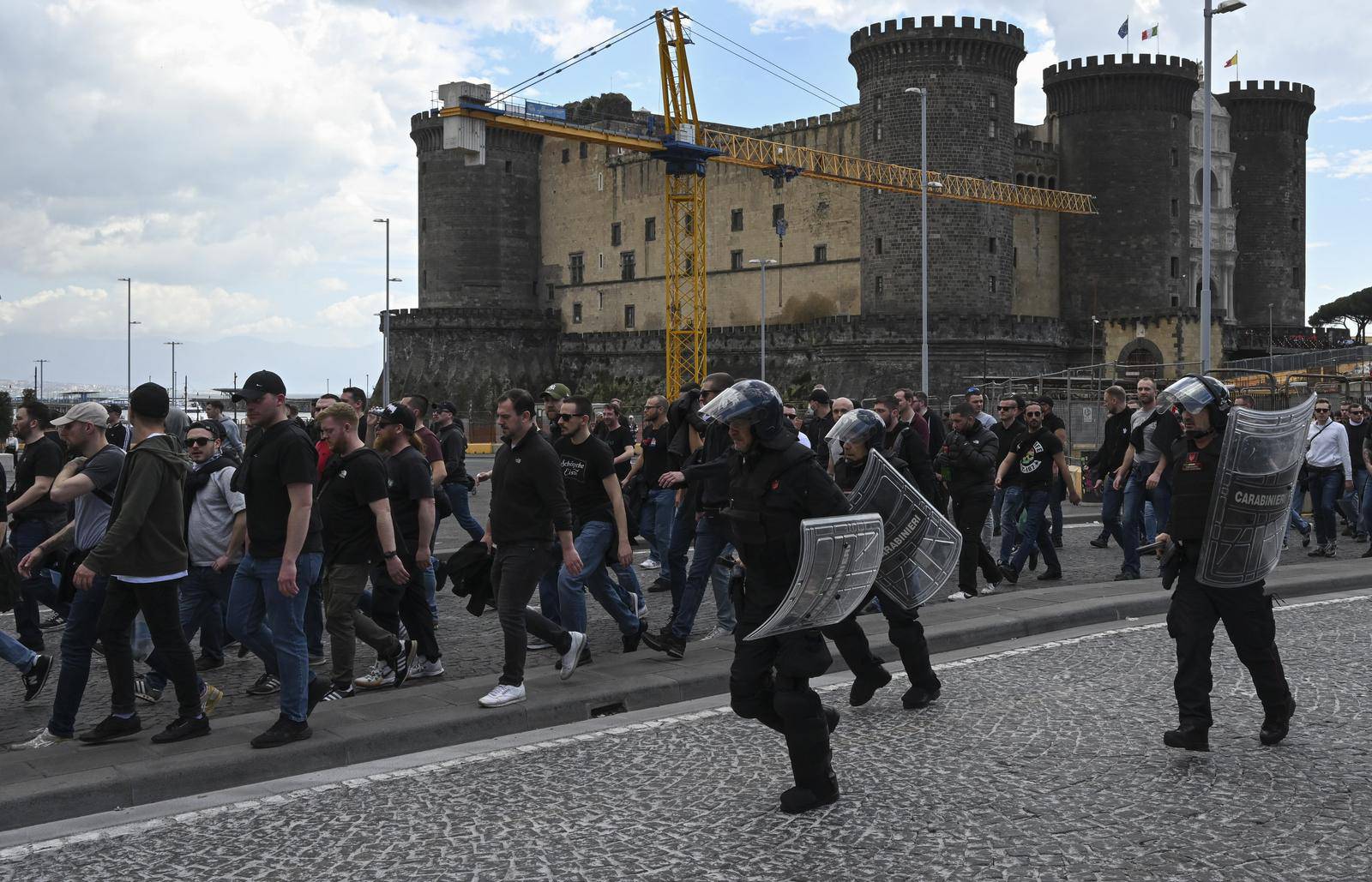 Italian police follow Eintracht Frankfurt fans walking through the streets of the city of Naples before the UEFA Champions League round of 16 return match between SSC Napoli and Eintracht Frankfurt.