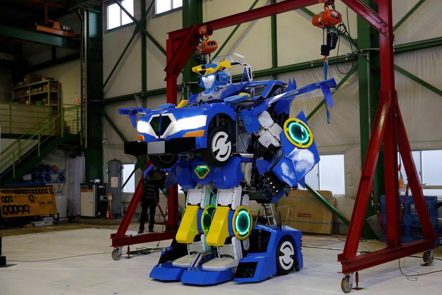 New transforming robot called "J-deite RIDE" that transforms itself into a passenger vehicle, developed by Brave Robotics Inc, Asratec Corp and Sansei Technologies Inc, demonstrates during its unveiling at a factory near Tokyo
