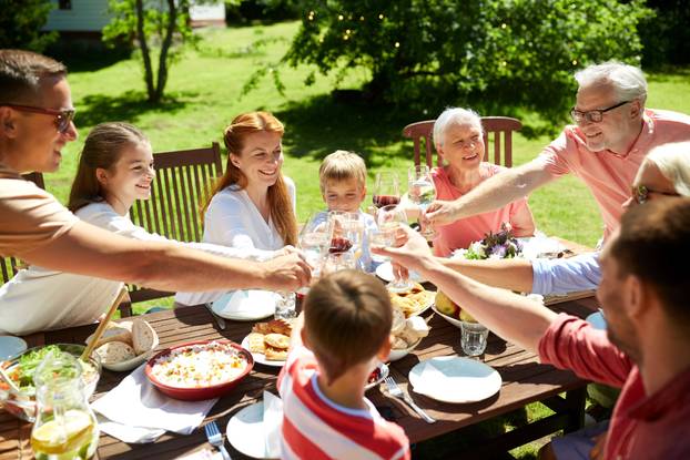 happy family having dinner or summer garden party