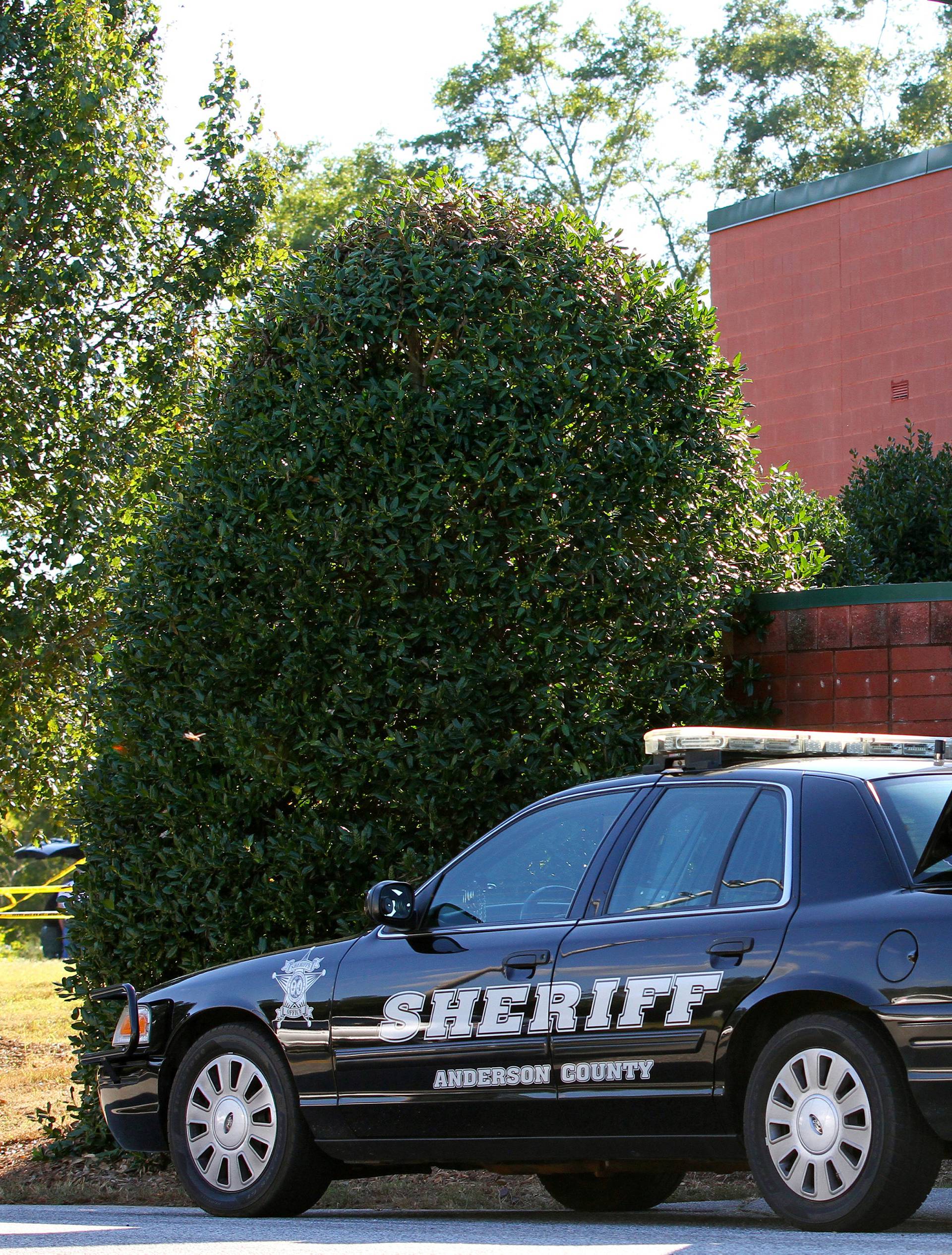 An Anderson County sheriff's deputy stands outside of Townville Elementary School after a shooting in Townville
