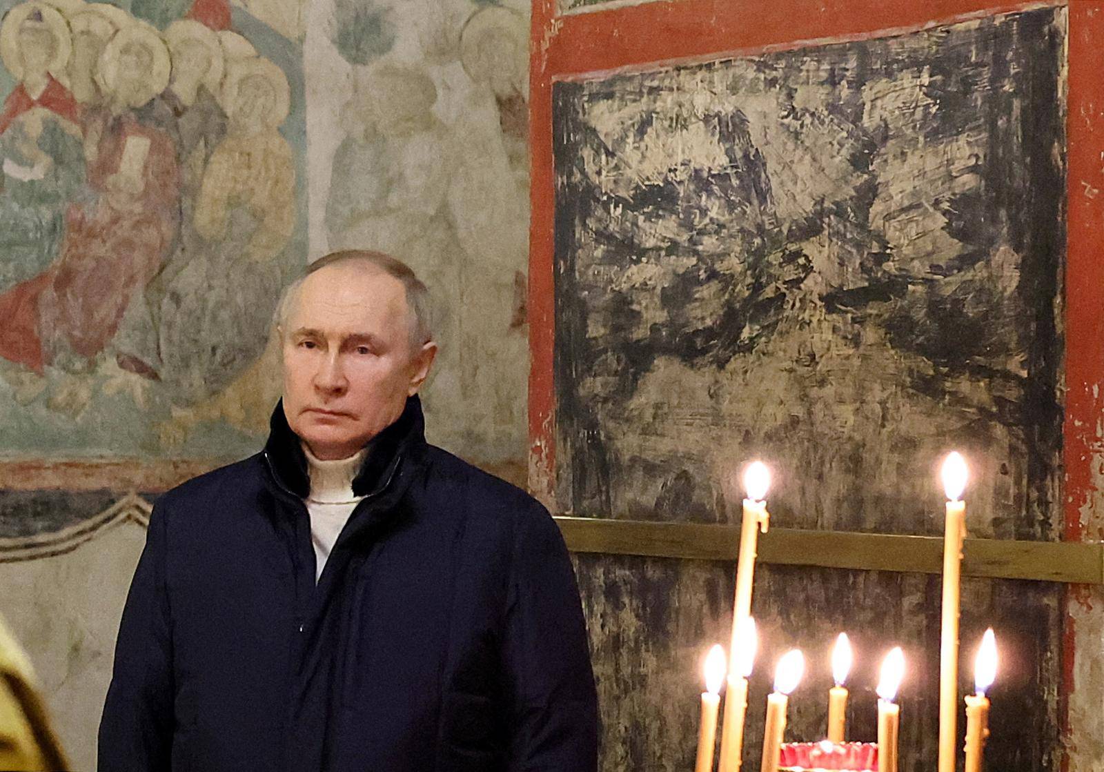 Russian President Vladimir Putin attends the Orthodox Christmas service in Moscow