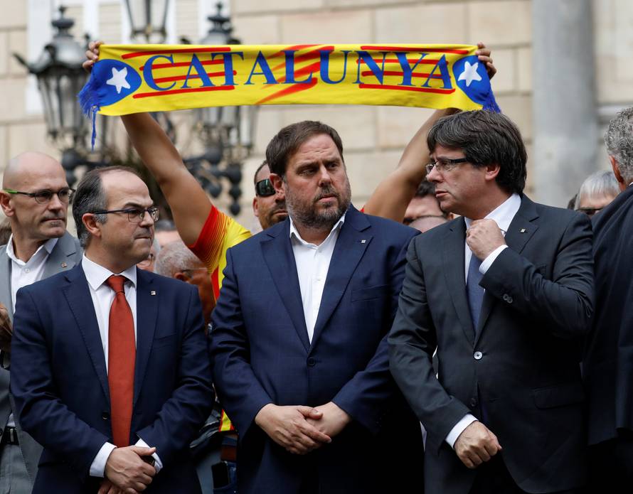 Catalan President Carles Puigdemont and other dignitaries stand in Plaza Sant Jaume in Barcelona