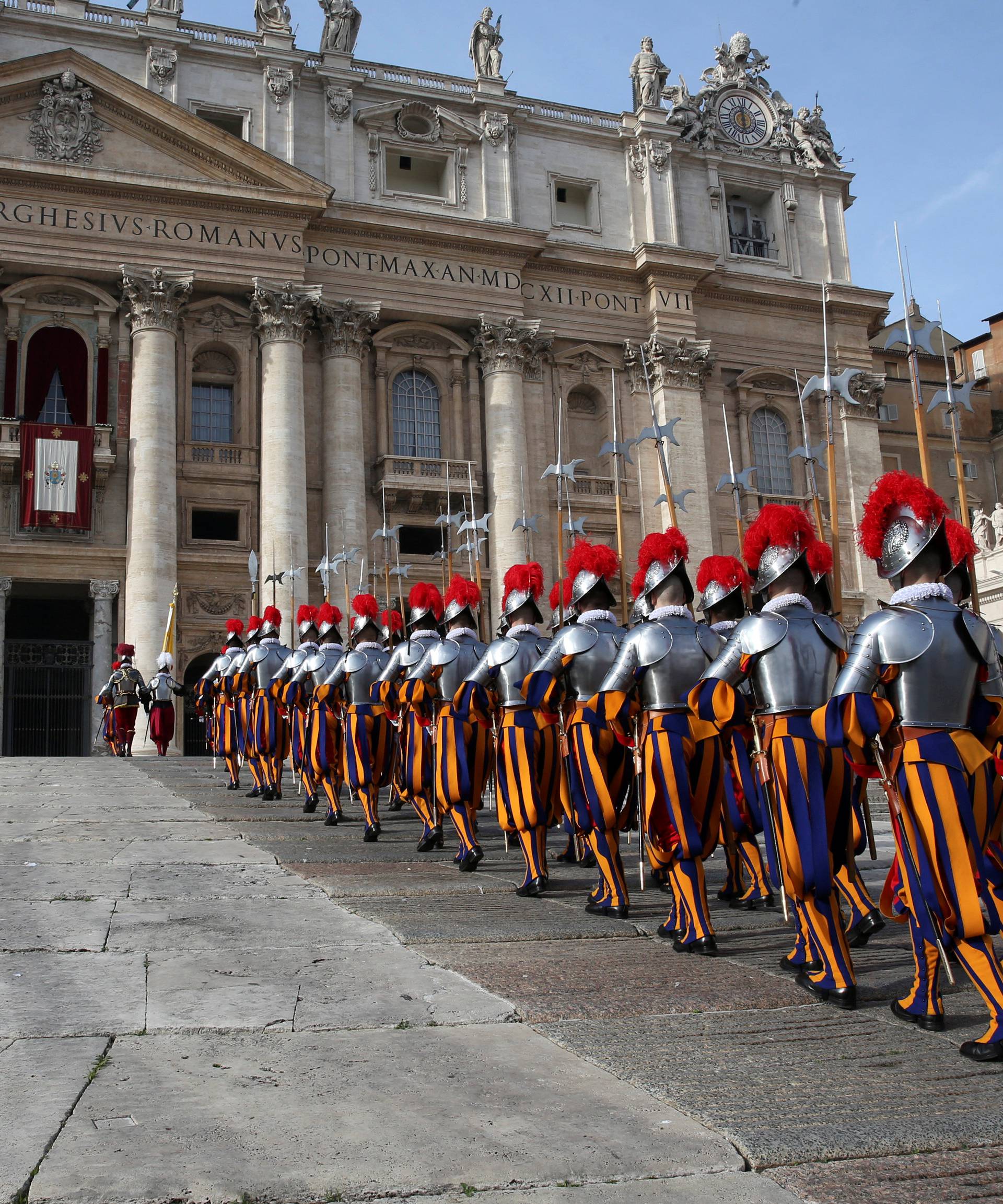 Swiss Guards arrive before Pope Francis delivering his "Urbi et Orbi" (to the city and the world) message from the balcony overlooking St. Peter's Square at the Vatican