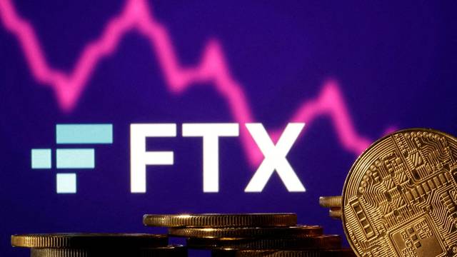 FILE PHOTO: FILE PHOTO: Illustration shows FTX logo, stock graph and representation of cryptocurrencies