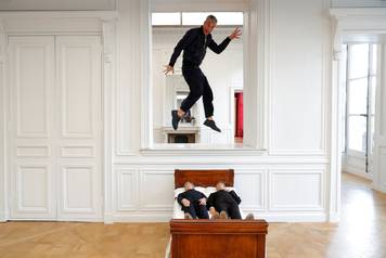 Italian artist Maurizio Cattelan poses with his creation "Is There Life Before Death" in Paris