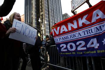 Demonstrators at the Women's March interact with supporters of President Donald Trump in Manhattan in New York City