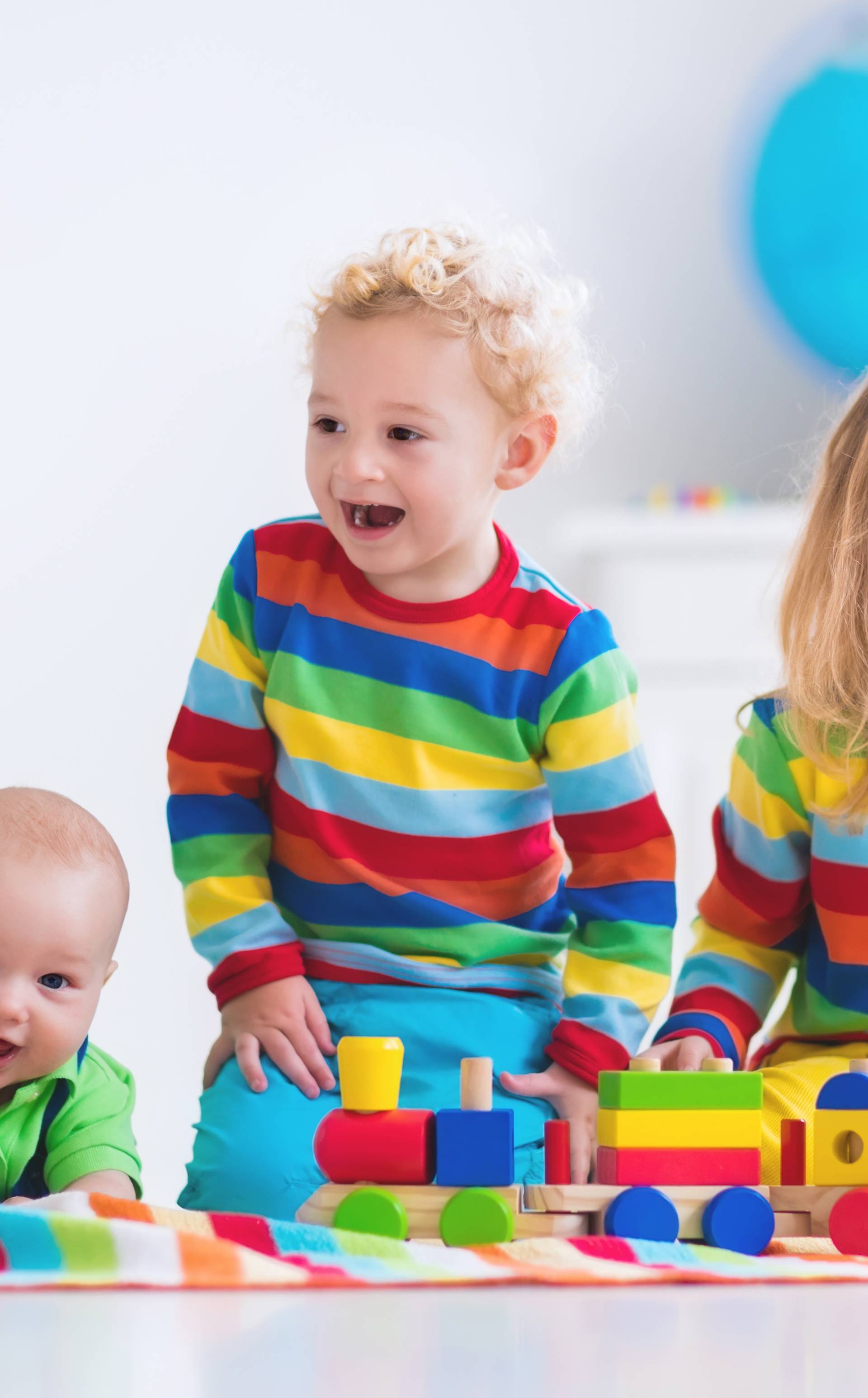 Kids playing with wooden toy train