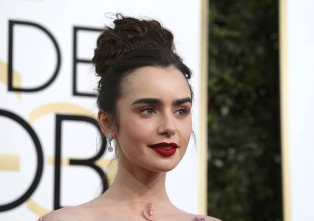 Actress Lily Collins arrives at the 74th Annual Golden Globe Awards in Beverly Hills