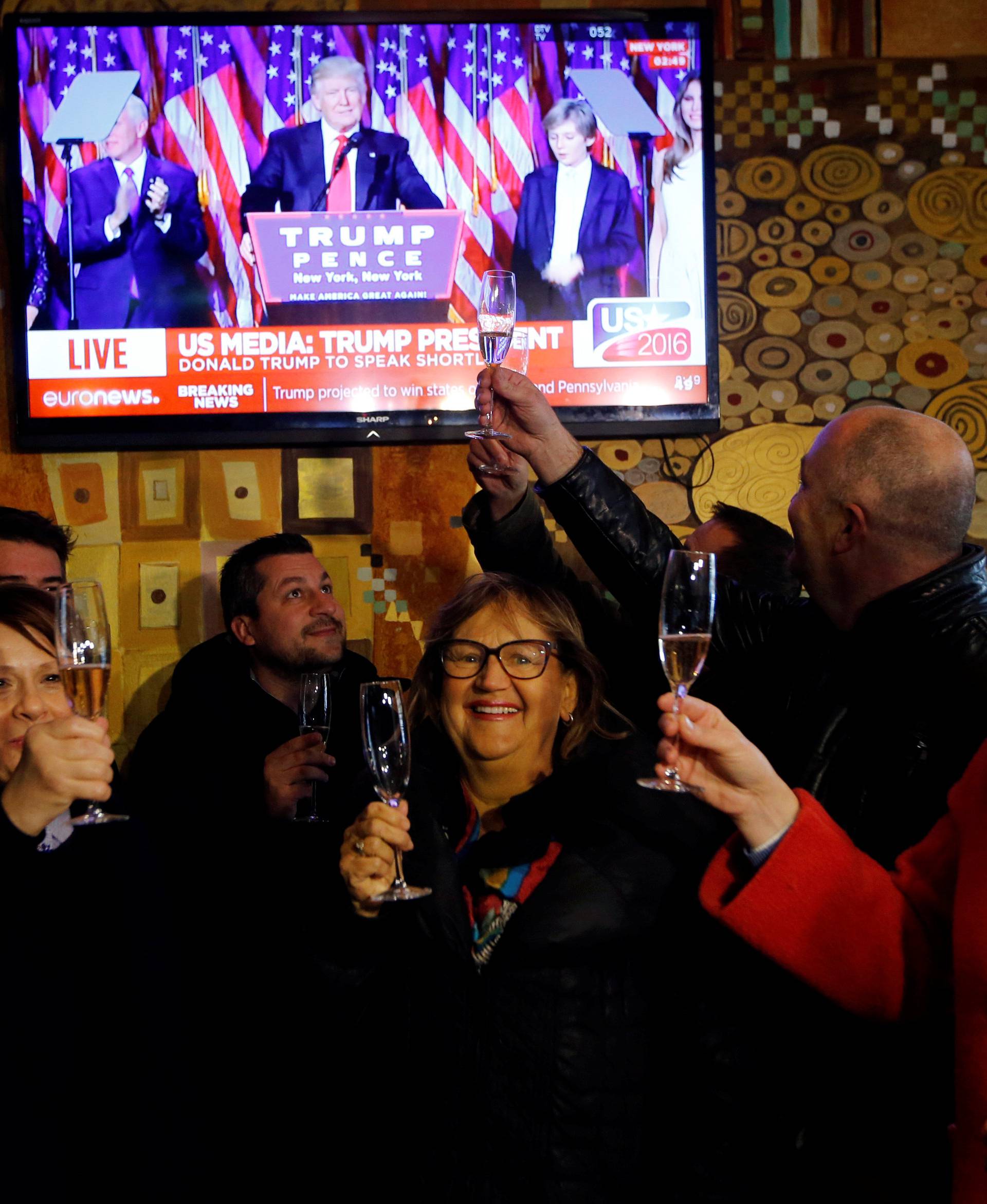 Residents celebrate during the U.S. presidential election in Melania Trump's hometown of Sevnica