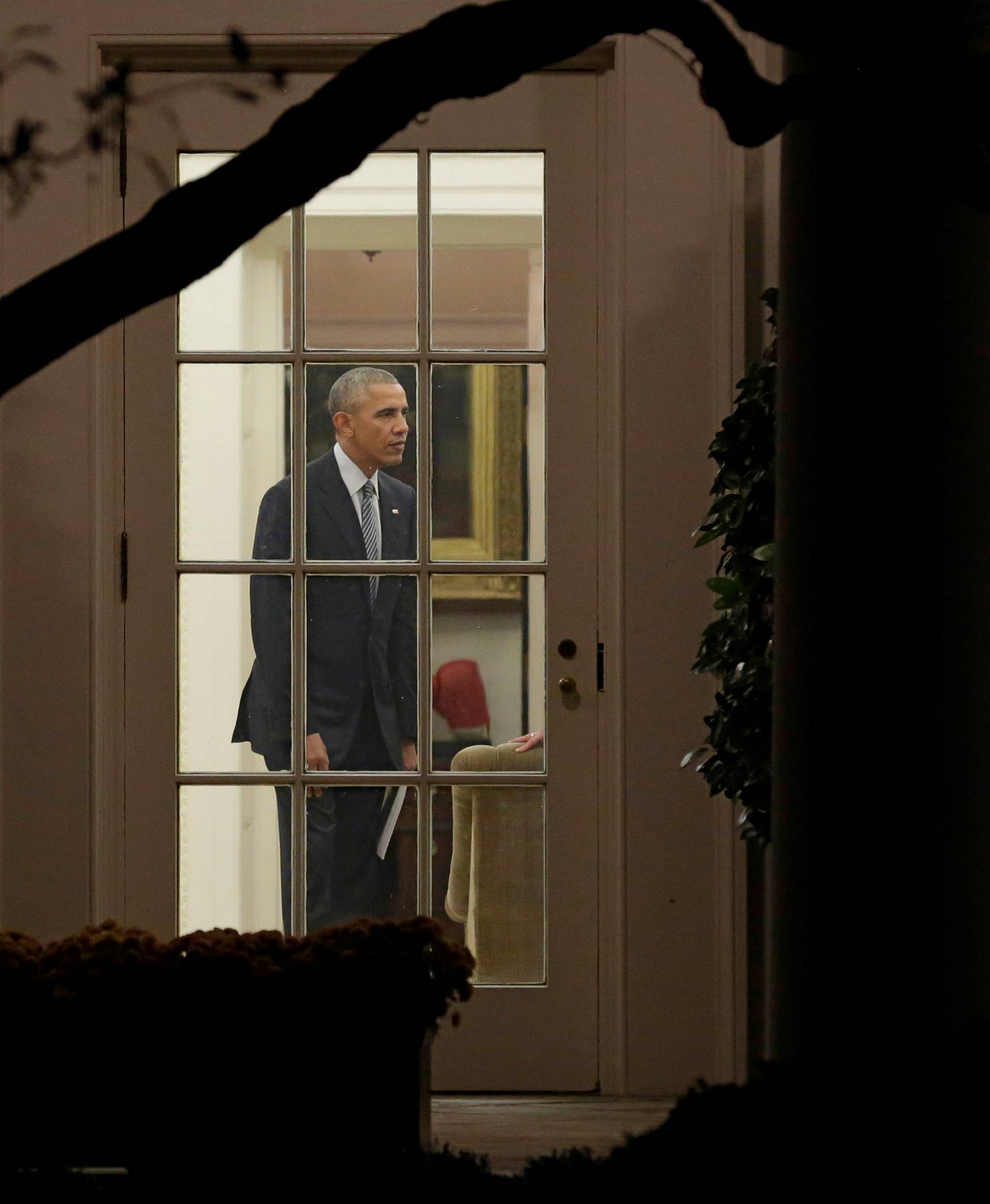 U.S. President Barack Obama stands in the Oval Office of the White House 