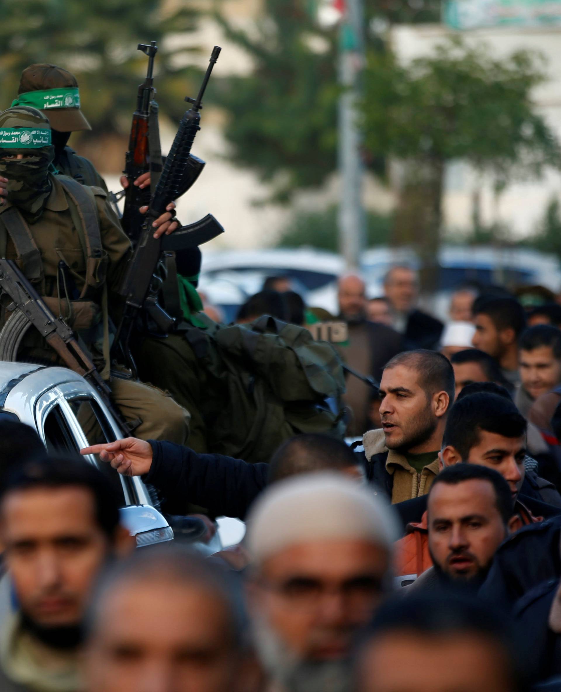 Palestinian Hamas militants take part in a protest against U.S. President Donald Trump's decision to recognize Jerusalem as the capital of Israel, in the northern Gaza Strip
