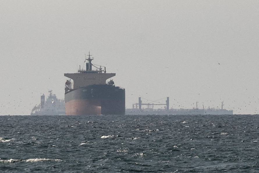 FILE PHOTO: Tankers sail in the Gulf, near the Strait of Hormuz